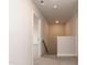 Hallway view with staircase and doorway, offering a transition between living spaces at 115 Kerr Walk Dr # 37, Statesville, NC 28677