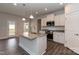 Modern kitchen island with sink, stainless steel appliances, and plenty of counter space at 115 Kerr Walk Dr # 37, Statesville, NC 28677