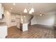 Open-concept kitchen with a center island, stainless steel appliances, and hardwood floors, perfect for modern living at 115 Kerr Walk Dr # 37, Statesville, NC 28677