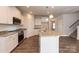 Modern kitchen featuring granite countertops, stainless appliances, and island at 115 Kerr Walk Dr # 37, Statesville, NC 28677