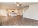 Open-concept living area and kitchen, with stainless steel appliances and wood floors at 115 Kerr Walk Dr # 37, Statesville, NC 28677