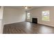 Bright living room with a fireplace, wood floors, and windows that let in plenty of sunlight at 115 Kerr Walk Dr # 37, Statesville, NC 28677