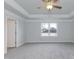 Spacious main bedroom with tray ceiling and a large window at 115 Kerr Walk Dr # 37, Statesville, NC 28677