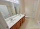 Bathroom features a double sink vanity and separate toilet and shower areas at 11624 Truan Ln, Cornelius, NC 28031