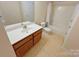 Full bathroom with a shower/tub combo, a wooden vanity and ample lighting, ideal for relaxing at 11624 Truan Ln, Cornelius, NC 28031