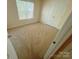 Cozy carpeted bedroom with natural light from the window and closet providing ample storage at 11624 Truan Ln, Cornelius, NC 28031