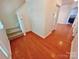 Bright foyer featuring hardwood floors and staircase to the upper level at 11624 Truan Ln, Cornelius, NC 28031