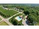 A beautiful aerial view of the neighborhood that features a pool and green lawns and trees at 118 Kerr Walk Dr # 17, Statesville, NC 28677