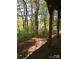 Serene backyard view featuring lush trees and a pathway for hiking and other outdoor recreation at 118 Kerr Walk Dr # 17, Statesville, NC 28677