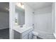 Clean bathroom featuring a combination tub and shower, white vanity, contemporary light fixtures and vinyl flooring at 118 Kerr Walk Dr # 17, Statesville, NC 28677