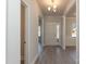 The entryway of this home features sleek flooring, a chandelier, a white front door, and an open floorplan at 118 Kerr Walk Dr # 17, Statesville, NC 28677