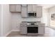 This kitchen shows stainless steel appliances, granite countertops, modern cabinets, and ample space at 118 Kerr Walk Dr # 17, Statesville, NC 28677
