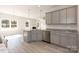 This modern kitchen has stainless steel appliances, a large island, and sleek cabinets for a contemporary design at 118 Kerr Walk Dr # 17, Statesville, NC 28677
