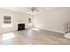 Bright living room with fireplace and large windows at 118 Kerr Walk Dr # 17, Statesville, NC 28677