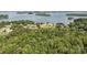 Panoramic aerial view of lakefront properties with lush trees, showcasing serene waterfront living at 14515 Nc Hwy 73 Hwy, Huntersville, NC 28078
