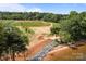 Lakefront lot ready for building, featuring sandy beach, rip rap shore and newly planted trees at 14515 Nc Hwy 73 Hwy, Huntersville, NC 28078