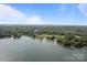 Expansive aerial view of lakefront property with docks, showcasing lush greenery and tranquil waters at 14515 Nc Hwy 73 Hwy, Huntersville, NC 28078