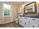 Bathroom with white vanity, solid surface counters, and modern mirror at 1506 Cameron Dr, Statesville, NC 28625