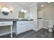 Bathroom featuring a double vanity, granite counters, white cabinetry and tiled walk-in shower at 1506 Cameron Dr, Statesville, NC 28625