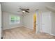 Lofted bedroom with neutral carpet, ceiling fan and natural light from two windows at 1506 Cameron Dr, Statesville, NC 28625
