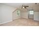 Lofted bedroom with neutral carpet, ceiling fan and natural light from two windows at 1506 Cameron Dr, Statesville, NC 28625