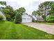 Well-maintained home exterior with a long driveway leading to an attached two-car garage and mature trees at 1506 Cameron Dr, Statesville, NC 28625