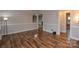 Open concept living room featuring hardwood floors and neutral wall colors at 1506 Cameron Dr, Statesville, NC 28625