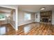 Spacious living room with a stone fireplace and hardwood floors at 1506 Cameron Dr, Statesville, NC 28625