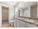 Bathroom featuring a dual-sink vanity with granite countertop, a separate toilet, and a glass-enclosed shower at 1508 Doran Ter, Richburg, SC 29729