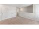 Bright hallway area featuring plush carpeting, white walls, and ample closet space perfect for storage solutions at 1508 Doran Ter, Richburg, SC 29729