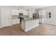 Bright kitchen with stainless steel appliances, granite countertops, and an island with a sink at 1508 Doran Ter, Richburg, SC 29729