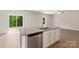 Kitchen island featuring stainless steel dishwasher, white cabinets, and granite countertops at 1508 Doran Ter, Richburg, SC 29729