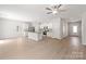 Open floor plan with hardwood floors, a ceiling fan, and a modern kitchen with stainless steel appliances at 1508 Doran Ter, Richburg, SC 29729