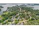 Beautiful aerial view of a lakeside community, showcasing lush greenery, manicured lawns, and serene waterfront living at 17308 Players Ridge Dr, Cornelius, NC 28031