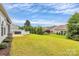 Serene backyard with a well-kept lawn, lush greenery, and privacy fencing at 17436 Hawks View Dr, Indian Land, SC 29707