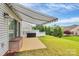 A spacious backyard featuring an awning and outdoor patio seating for relaxing or entertaining at 17436 Hawks View Dr, Indian Land, SC 29707