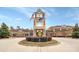 A stately clock tower marks the Sun City Carolina Lakes by Del Webb building, surrounded by mature landscaping at 17436 Hawks View Dr, Indian Land, SC 29707