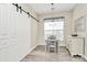 Cozy dining area with a stylish light fixture, charming table, and ample natural light at 17436 Hawks View Dr, Indian Land, SC 29707