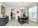 Dining room features a dark wood dining set with light wood floors and white trim at 17436 Hawks View Dr, Indian Land, SC 29707