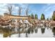 Entrance to Sun City Carolina Lakes, featuring a rock waterfall and pond at 17436 Hawks View Dr, Indian Land, SC 29707