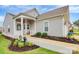 Charming home featuring a covered front porch, manicured lawn, and inviting curb appeal at 17436 Hawks View Dr, Indian Land, SC 29707