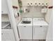 A laundry room with a washer, dryer, and convenient shelving for storage at 17436 Hawks View Dr, Indian Land, SC 29707