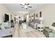Bright open-concept living space with dining and kitchen featuring a neutral color palette and light wood floors at 17436 Hawks View Dr, Indian Land, SC 29707