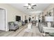 Bright open-concept living space featuring a neutral color palette, light wood floors, and ample seating at 17436 Hawks View Dr, Indian Land, SC 29707