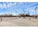 Outdoor tennis courts featuring well-maintained playing surfaces, netting, and lighting for evening play at 17436 Hawks View Dr, Indian Land, SC 29707