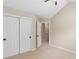 Bedroom with carpeted floor, double door closet and view to additional spaces in the home at 18840 Silver Quay Dr # 12, Cornelius, NC 28031