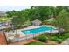 Aerial view of community pool and lounge area with waterfront views at 18840 Silver Quay Dr # 12, Cornelius, NC 28031