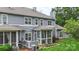 Charming home exterior featuring a screened porch and well-maintained landscaping at 18840 Silver Quay Dr # 12, Cornelius, NC 28031