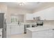 Bright kitchen with stainless steel appliances, white cabinets, and light countertops at 18840 Silver Quay Dr # 12, Cornelius, NC 28031