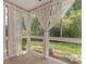 Sunroom with white curtains and views of the backyard at 18840 Silver Quay Dr # 12, Cornelius, NC 28031